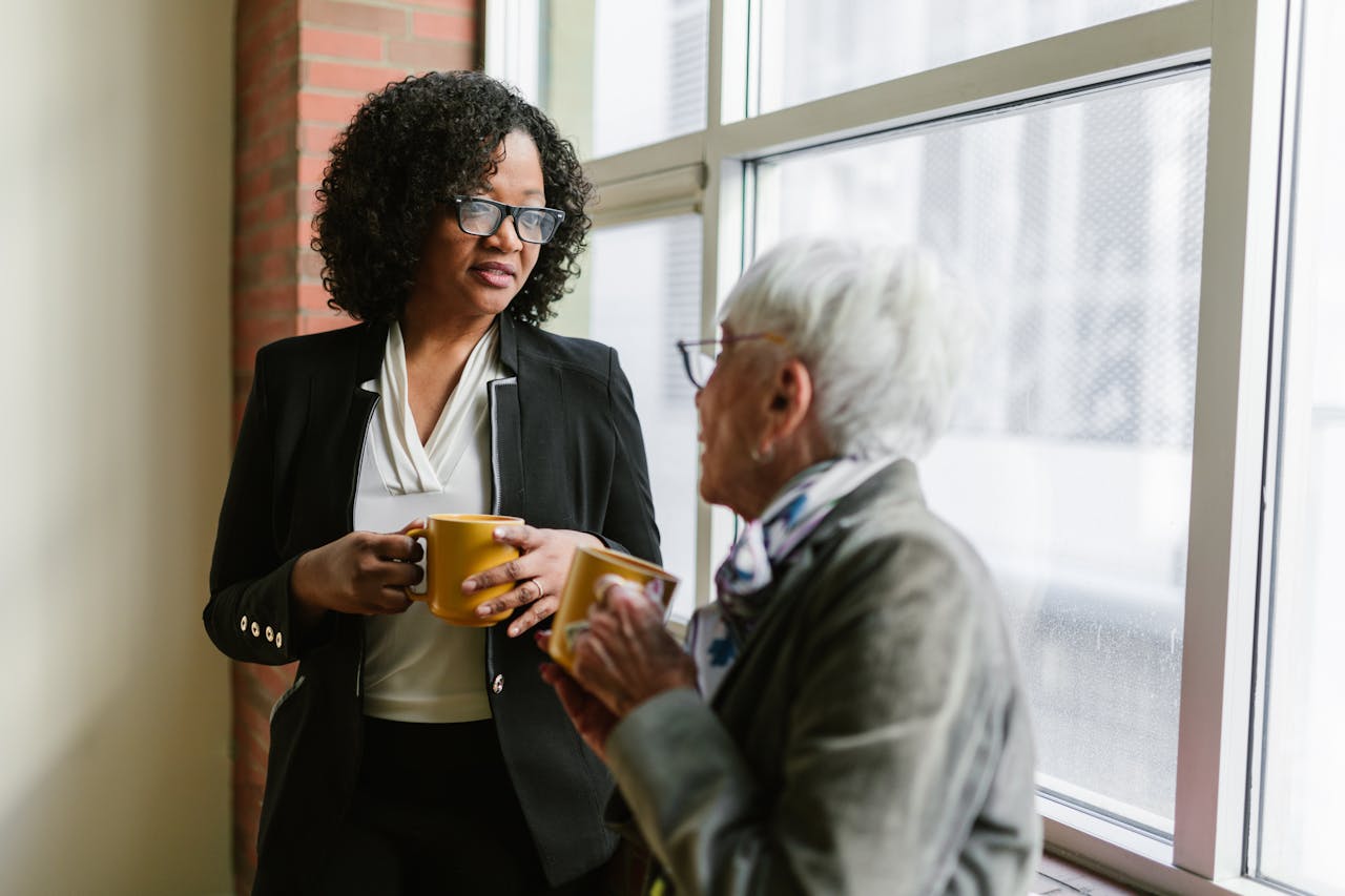 Staff supporting elderly lady